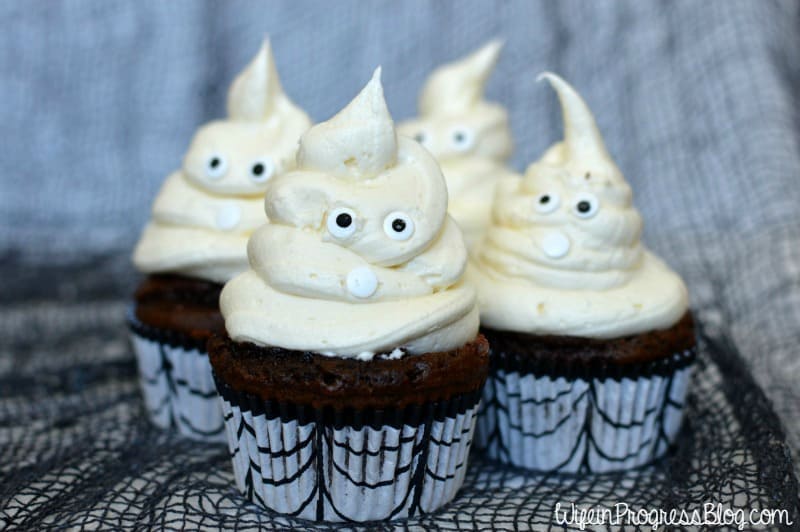 Pipe the vanilla icing onto your chocolate cupcakes in a swirl to make a spooky ghost form