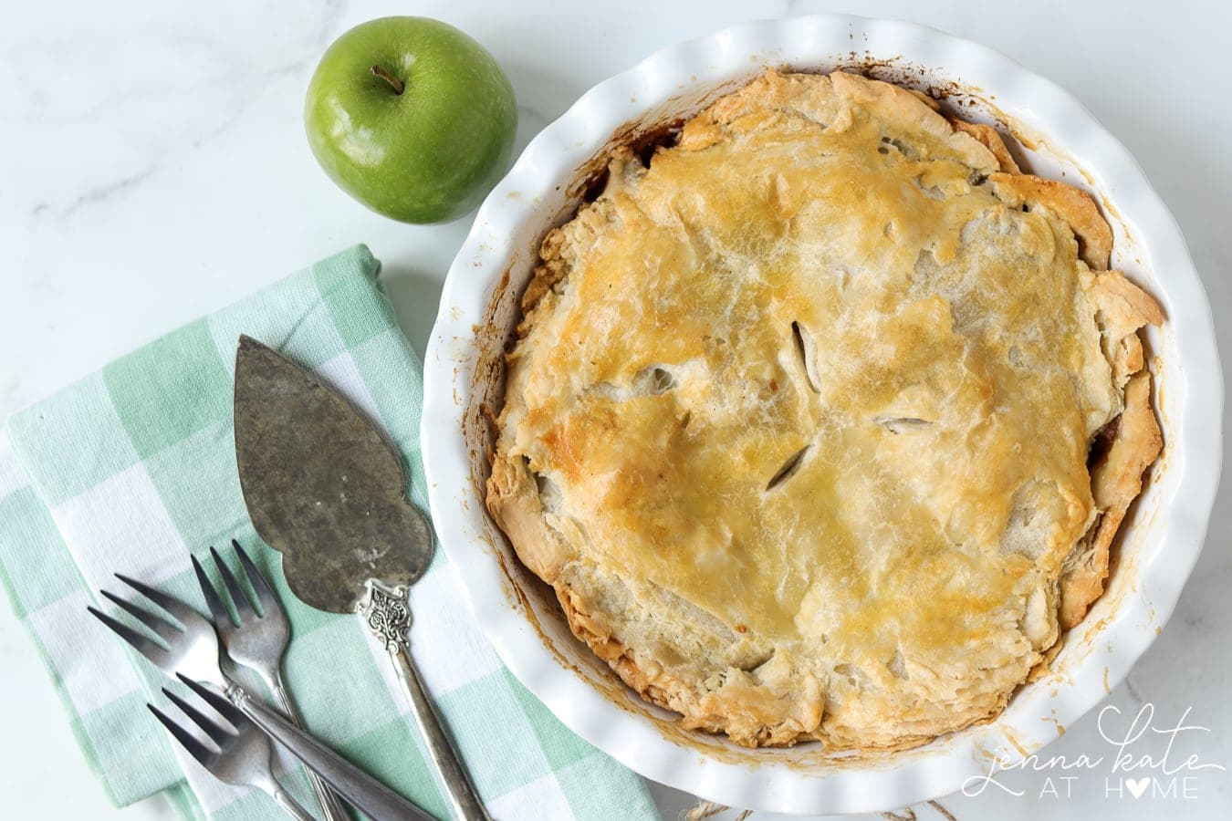flaky apple pie in a pie dish