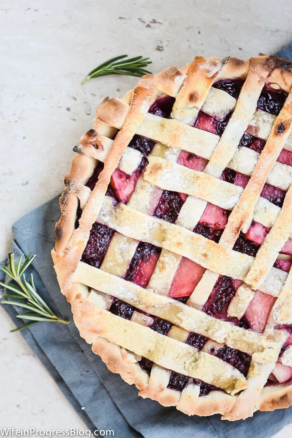 close up of the filling and lattice on the blackberry apple pie