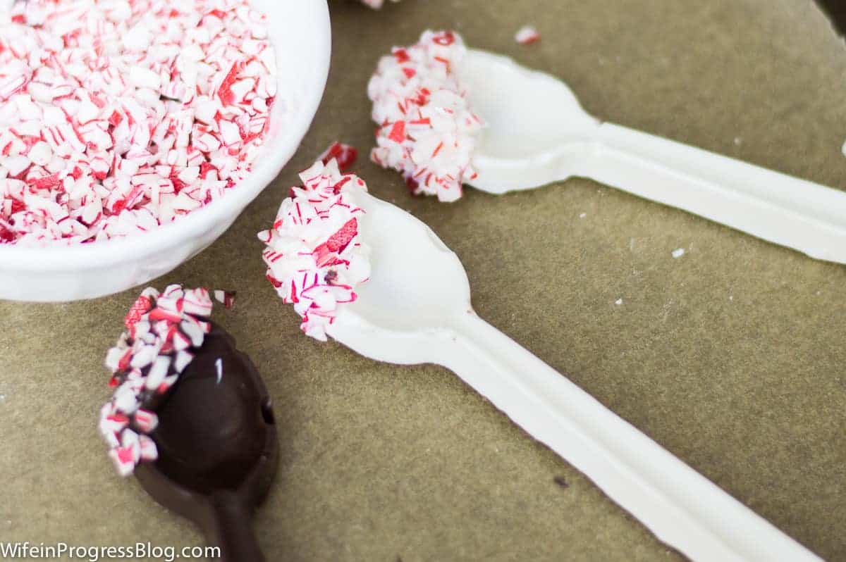 Spoons made using chocolate molds and dipped in crushed candy cane