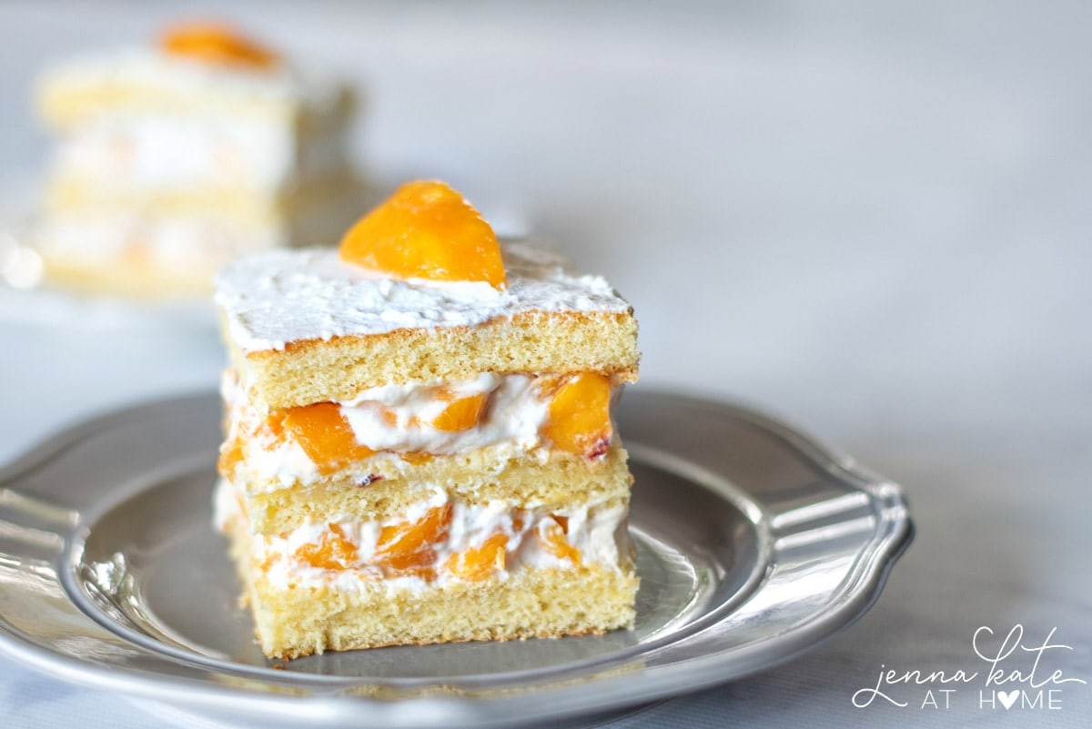 Make this cake with fresh or canned peaches layered between moist sponge and homemade whipped cream