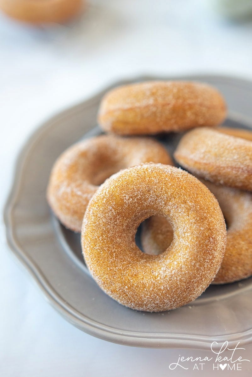 These baked pumpkin spice donuts are coated in cinnamon sugar and are so much easier to make than the yeast variety