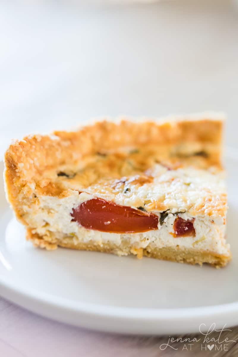 This tomato pie has layers of juicy tomato and basil in a creamy buttermilk parmesan custard filling