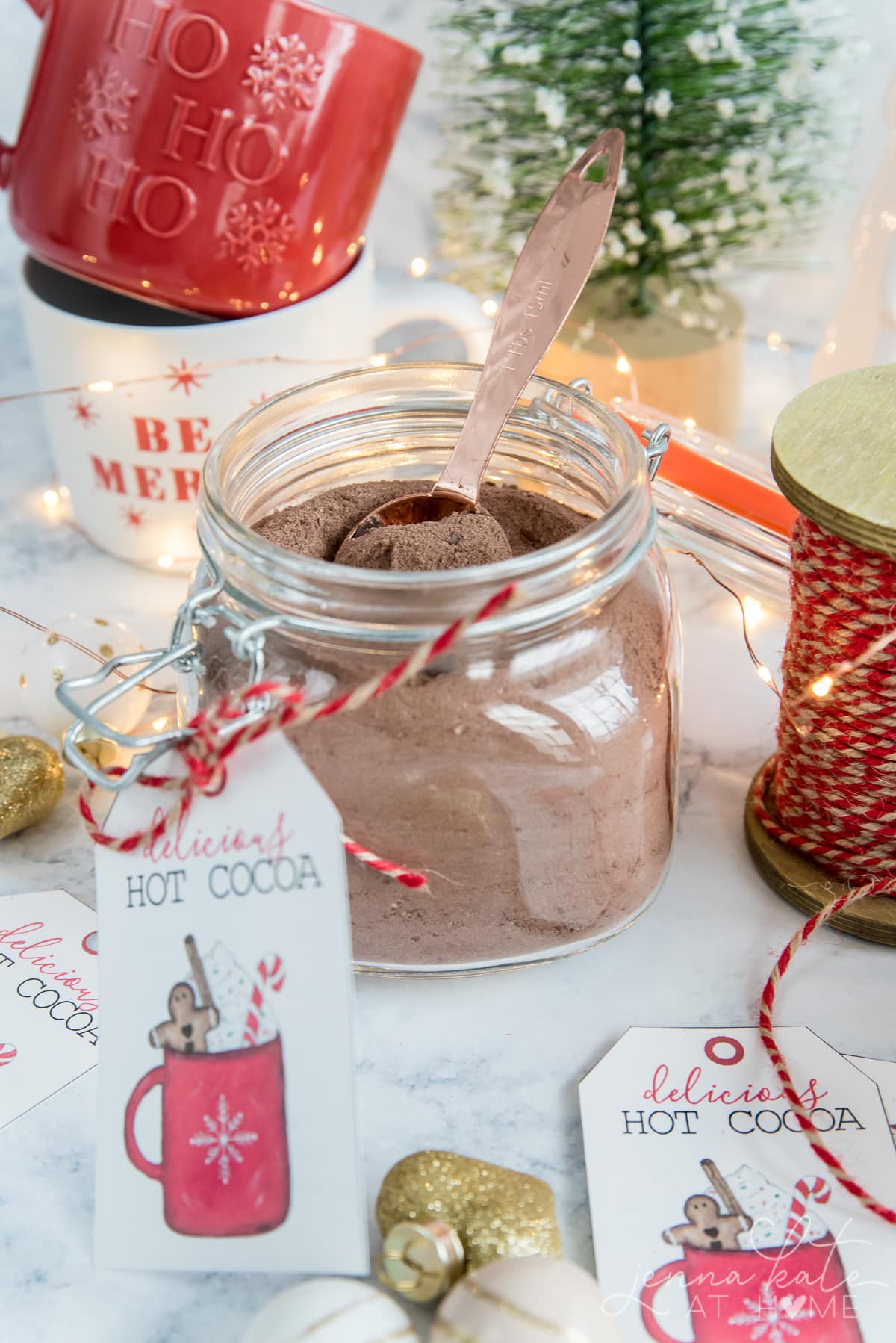 Close up of hot chocolate mix surrounded by festive objects