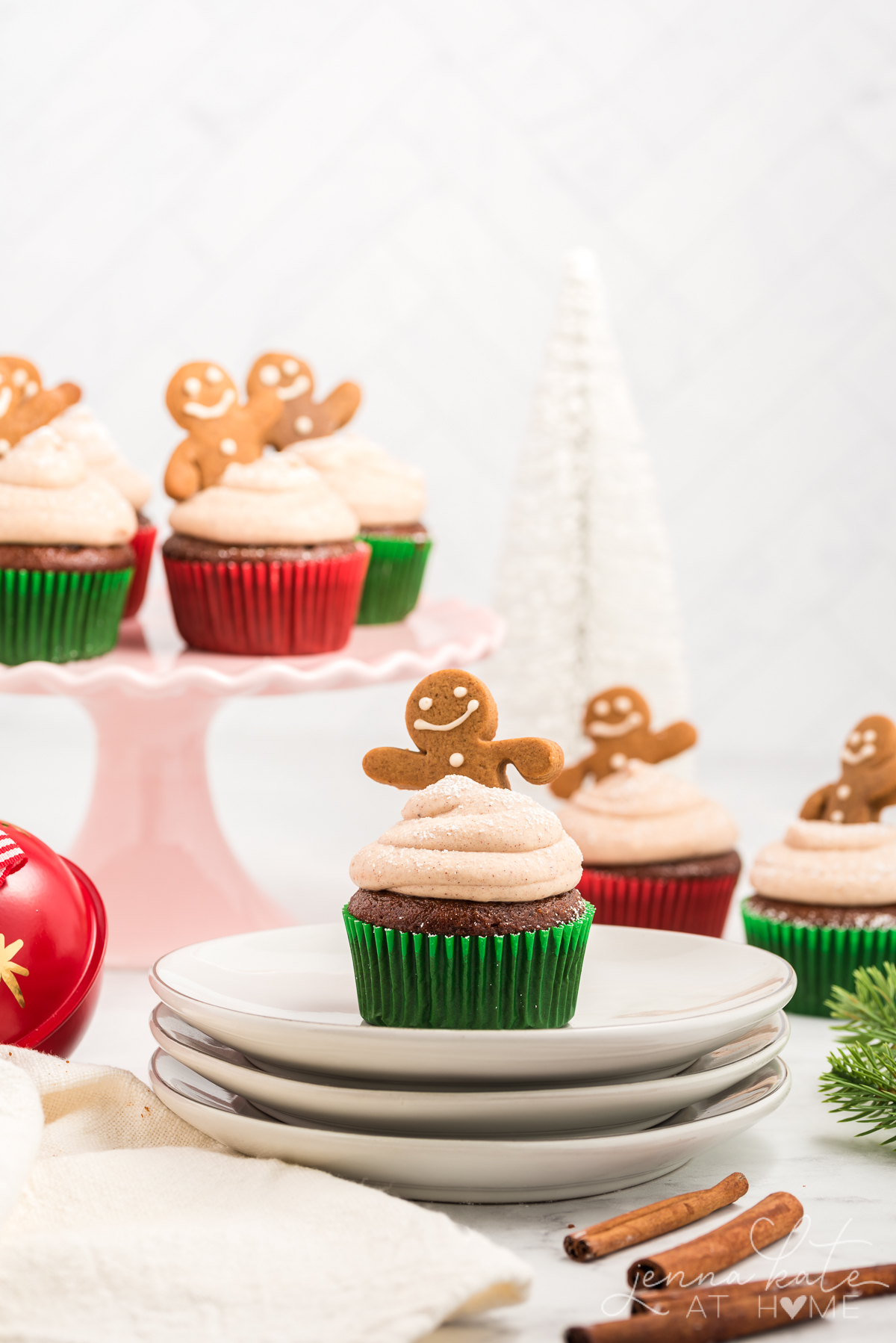 gingerbread cupcake with a mini gingerbread man stuck into the frosting