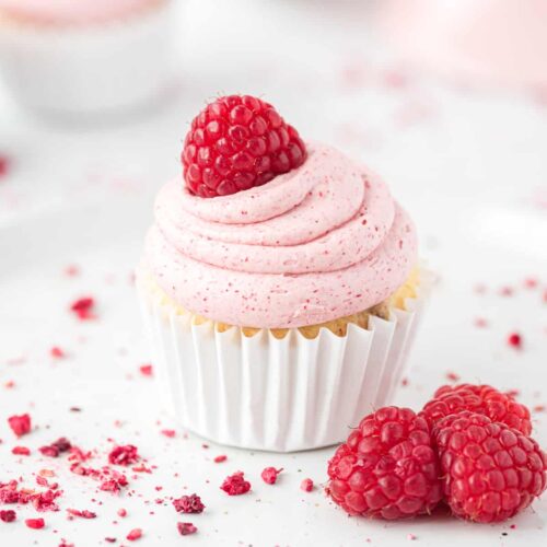 cupcake with raspberry frosting and raspberry on top