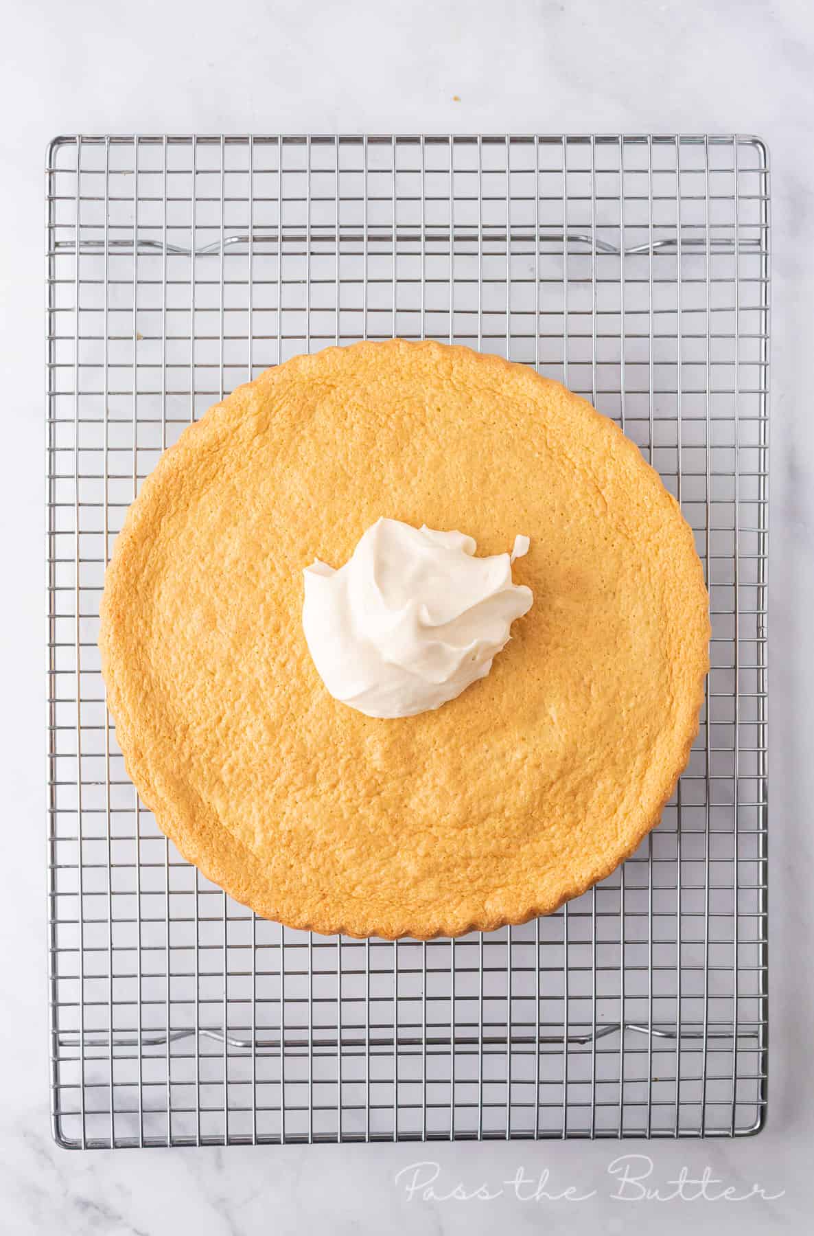 Spread the whipped cream over the flan base